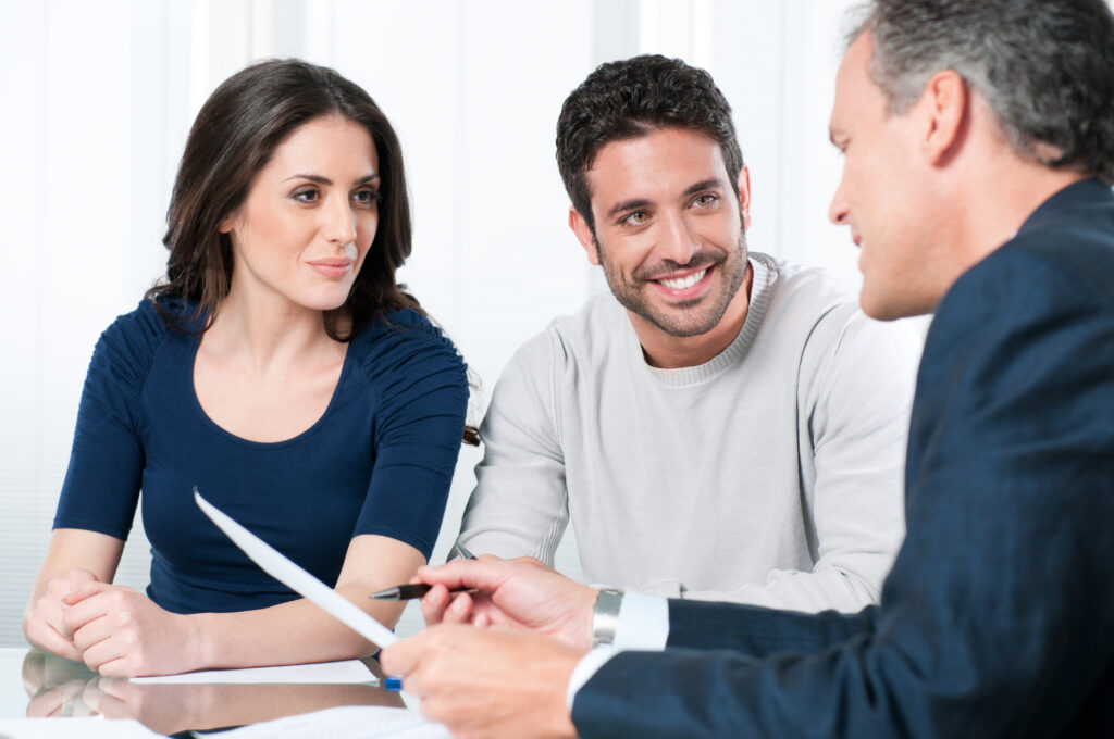 Financial consultant presents cash advance offer to a young couple